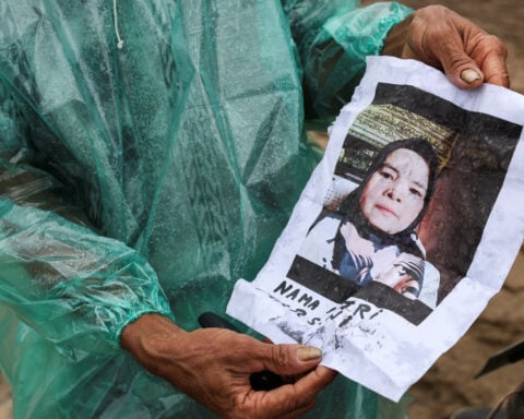 'Is she alive?': Indonesian man's hopes of finding missing wife fade after flood disaster