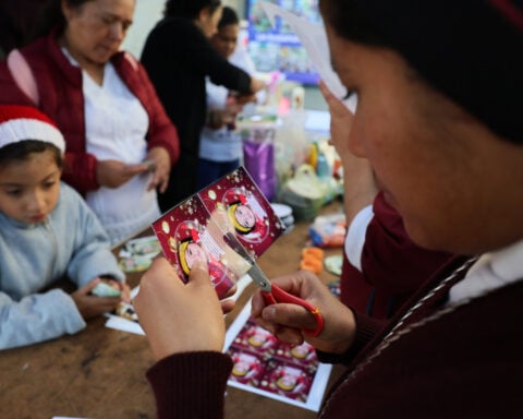 A Christmas tree in Mexico carries the faces of loved ones who never came home