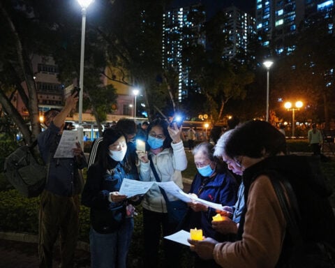 Hong Kong mourns victims of blaze that killed 128 and counting