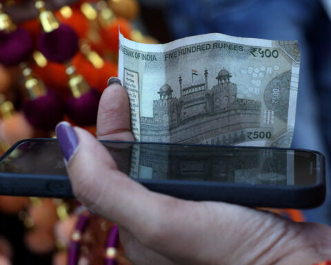 Rupee cracks below 90 to the dollar, hit by tariffs, capital outflows