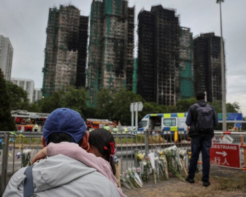 'Highly traumatised': Hong Kong presses ahead with elections after deadly fire