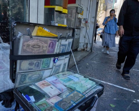 Iran's currency falls to a new low as nuclear sanctions squeeze its ailing economy