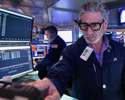 Wall Street pulls near its all-time high