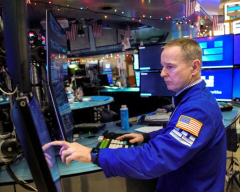 Wall St opens lower as investors assess data, Microsoft falls