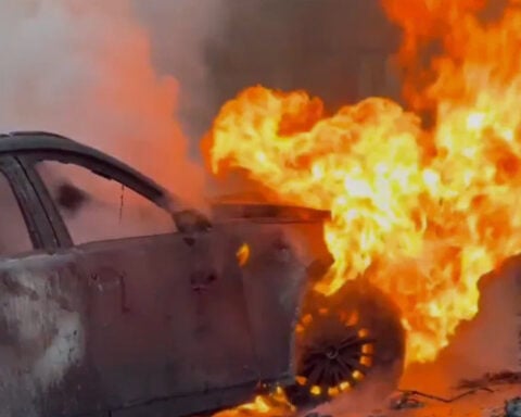 One hospitalized after electric vehicle catches fire inside garage