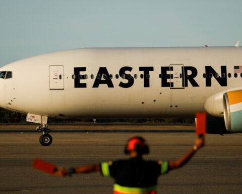 Plane from US carrying returned migrants lands in Venezuela, foreign minister says