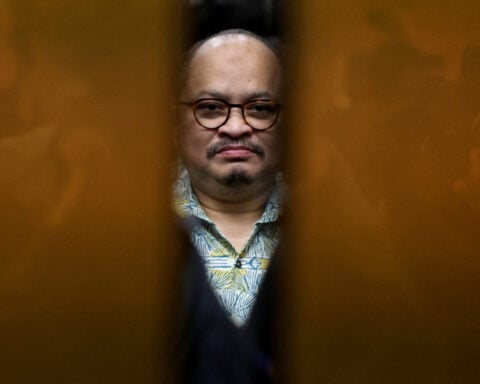 Malaysia charges PM's former aide with receiving bribes