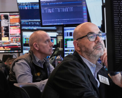 Wall Street inches closer to its all-time high