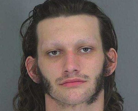 Man arrested after woman escapes armed abduction outside Walmart, police say