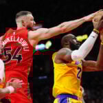 LeBron James' 1,297-game double-digit scoring streak ends but he gets winning assist vs. Raptors