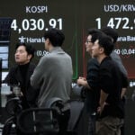 Asian shares are mixed after Wall Street inches closer to its all-time high