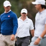 Rory McIlroy's late birdie burst means he'll be playing on the weekend at the Australian Open