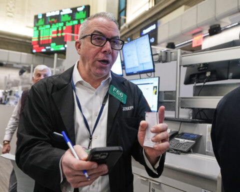 Wall Street rises to the edge of its all-time high