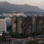 Hong Kong police arrest man for posts about deadly fire