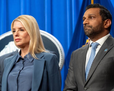 Trump administration plays up pipe bomb suspect's arrest. Jan. 6 violence goes unmentioned