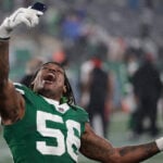 Quincy Williams arrives in Joker makeup for Jets' Gotham City game against Dolphins