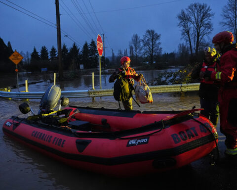 Storms bring heavy rain to the Pacific Northwest, snow and freezing rain to the Upper Midwest