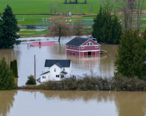 Tens of thousands ordered to flee flooding after torrential rain in Pacific Northwest