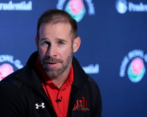 Morgan Scalley promoted from defensive coordinator to head coach at Utah, succeeding Whittingham