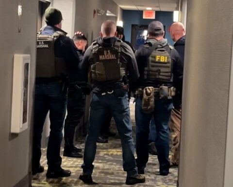 Person of interest in custody in Brown University shooting that left two students dead