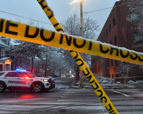 The Latest: A person is in custody after deadly Brown University shooting leaves 2 dead, 9 wounded