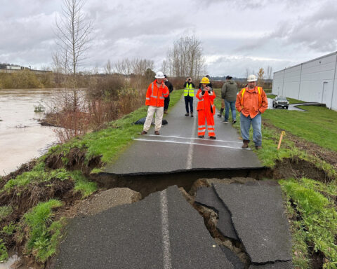 Crews use sandbags to shore up levee breach near Seattle after failure prompts flood warning
