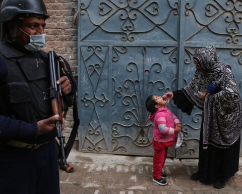 Suspected militants kill 2, including a police officer guarding polio team in northwestern Pakistan