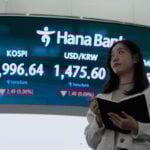 Asian shares are mixed and oil prices jump as Trump orders a blockade of oil tankers to Venezuela