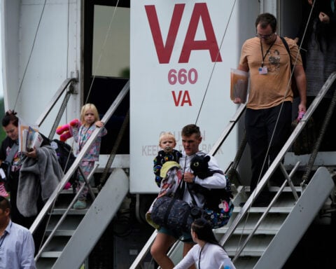 South African authorities raid a US refugee processing center and Washington protests