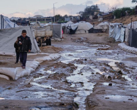 Israel fires mortar into Gaza residential area, wounding at least 10