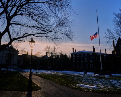 Investigators seek older video that might show the Brown campus shooter days before the attack