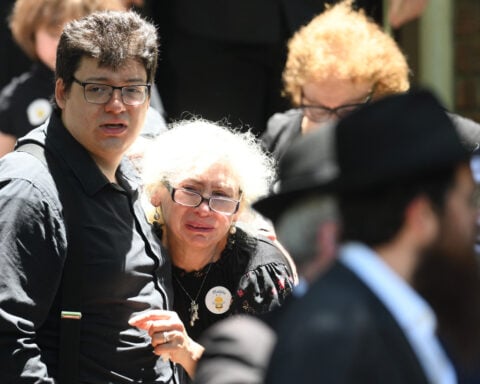 Mourners grieve 10-year-old slain in Bondi mass shooting as Australia's leader pledges new hate laws