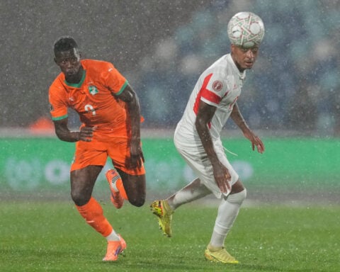 Ivory Coast starts Africa Cup title defense with a win as proud dad Zidane sees Algeria beat Sudan