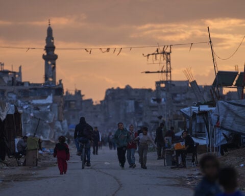 A Palestinian man kills 2 in car-ramming and stabbing attack in northern Israel and injures 2 others