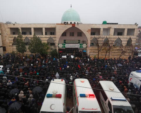 Hundreds mourn in Syria's Homs after deadly mosque bombing