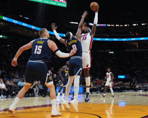 Nuggets star Nikola Jokic hurts left knee, limps off court at halftime in Miami