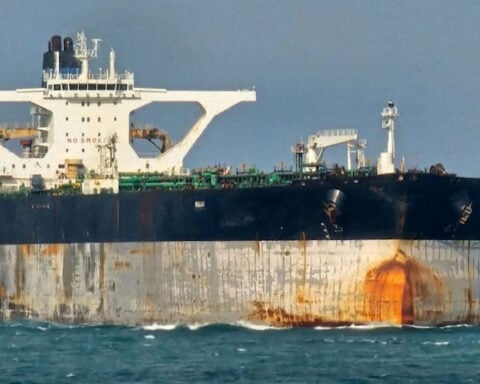 Oil tanker pursued by US now has a Russian flag painted on its side