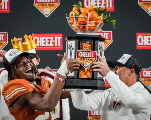 Manning uses arm and legs to lead No. 14 Texas to a 41-27 Citrus Bowl win over No. 18 Michigan