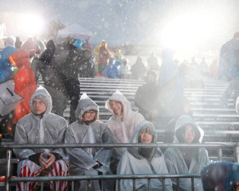 Rain soaks Rose Parade in California and snow squalls hit Midwest and Northeast on first day of 2026