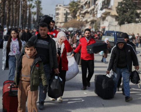 Civilians flee Aleppo as clashes between Syrian government and Kurdish forces escalate