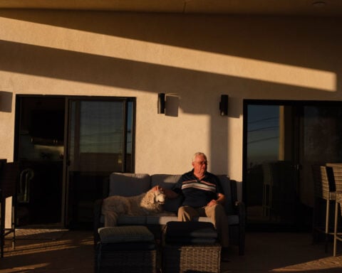 A man and his old dog are home at last after fleeing LA area fires