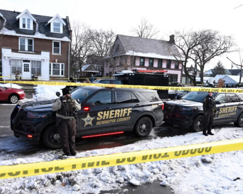 Large crowd gathering in Minneapolis following shooting of woman four blocks from where George Floyd was killed