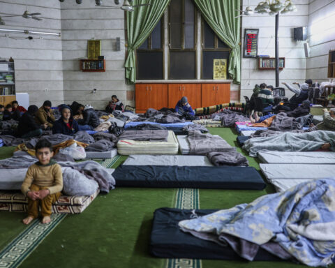 Tens of thousands flee Aleppo neighborhoods as Syrian government clashes with Kurds intensify