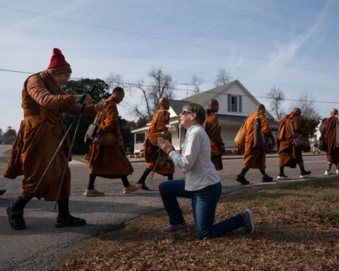 Buddhist monks and their dog captivate Americans while walking for peace