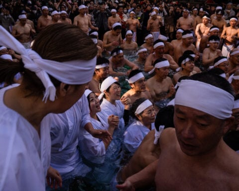 Japan dives into New Year with prayers and an icy plunge