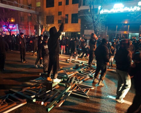 A morgue overflowing with more body bags than answers amid Iran’s latest crackdown on dissent