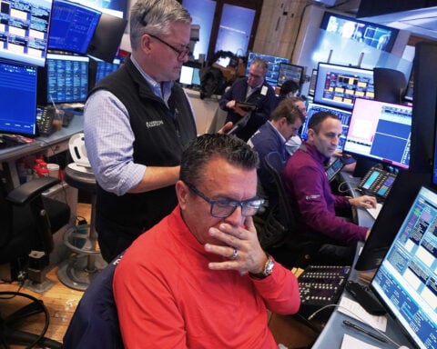 Wall Street pulls back from its records as JPMorgan Chase and Delta kick off earnings season