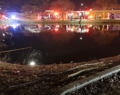 Father dies after car enters retention pond, police save two children