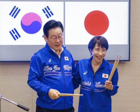 Japanese and South Korean leaders jam to K-pop hits at a summit