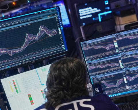 Wall Street slumps as bank and tech stocks fall